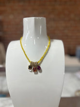 Load image into Gallery viewer, TOVA yellow beaded necklace with gold rings and stones
